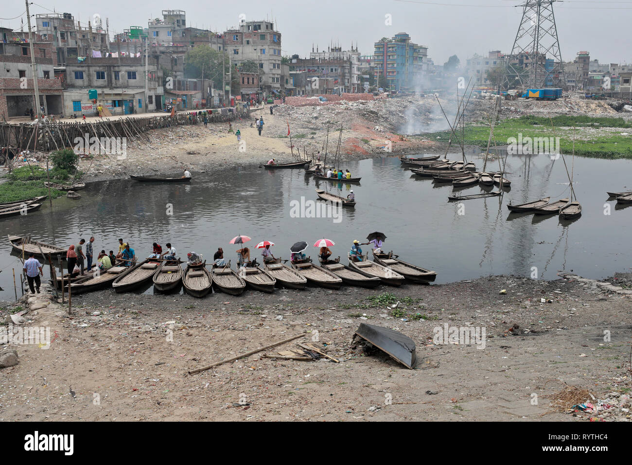 Dhaka, Bangladesh. 15th Mar, 2019. A branch river of the buriganga shrinks to a canal at Shahidnagar point in kamrangichar area on the outskirts of the Dhaka. The river extremely polluted because of the chemical waste of mills and factories eventually make its way into the River. The river has suffered extreme biodiversity loss and has now turned black. Credit: SK Hasan Ali/Alamy Live News Stock Photo