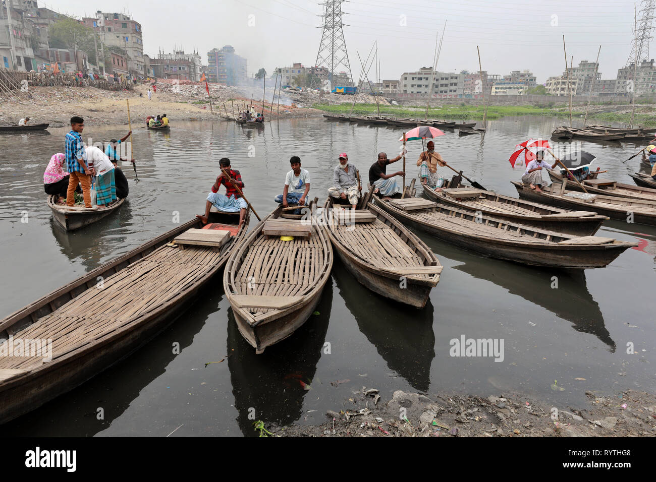 Dhaka, Bangladesh. 15th Mar, 2019. A branch river of the buriganga shrinks to a canal at Shahidnagar point in kamrangichar area on the outskirts of the Dhaka. The river extremely polluted because of the chemical waste of mills and factories eventually make its way into the River. The river has suffered extreme biodiversity loss and has now turned black. Credit: SK Hasan Ali/Alamy Live News Stock Photo