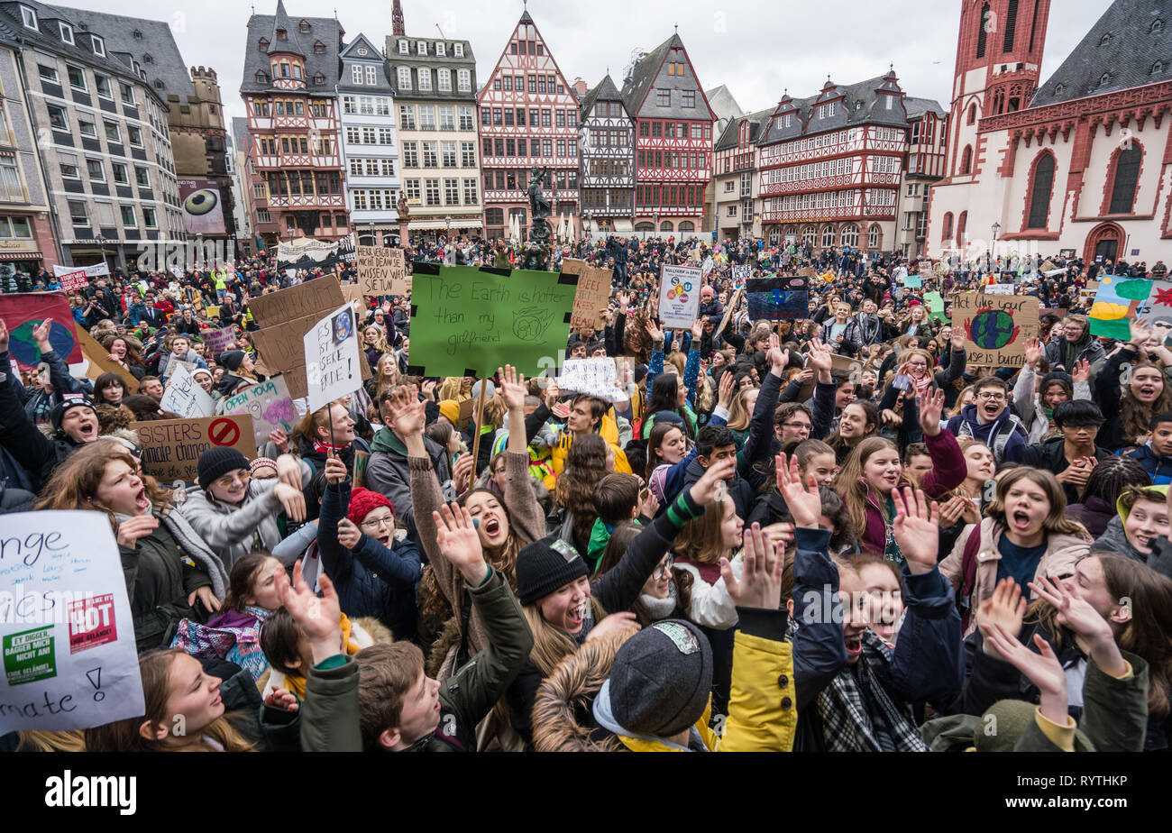 15 March 2019, Hessen, Frankfurt/Main: Young demonstrators fill the entire Römerberg during a climate rally. Under the motto #FridaysForFuture, around 1700 rallies in around 100 countries worldwide are on the programme, including various German cities. The students demand drastic steps against global warming. Photo: Frank Rumpenhorst/dpa Stock Photo