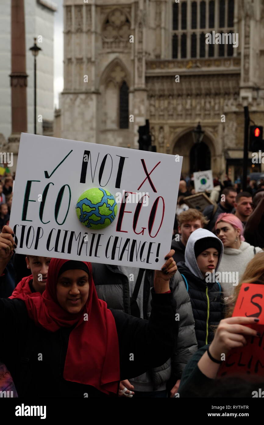 London, United Kinngdom - Friday 15 March 2019: Thousands of students and supporters gathered to picket on Parliament Square and The Departmnent for Business Energy and Industrial Strategy in support of Youth Strike 4 Climate. The #fridaysforfuture movement was started by Greta Thunberg, a 16 year-old Swedish Climate Activist and has gained momentum around the world. Stock Photo