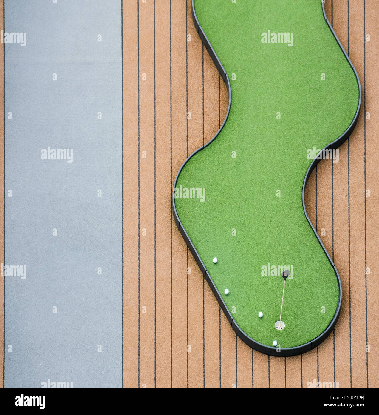 Abstract view of Games on board of a cruise ship miniature golf, shuffle board and chairs, Stock Photo