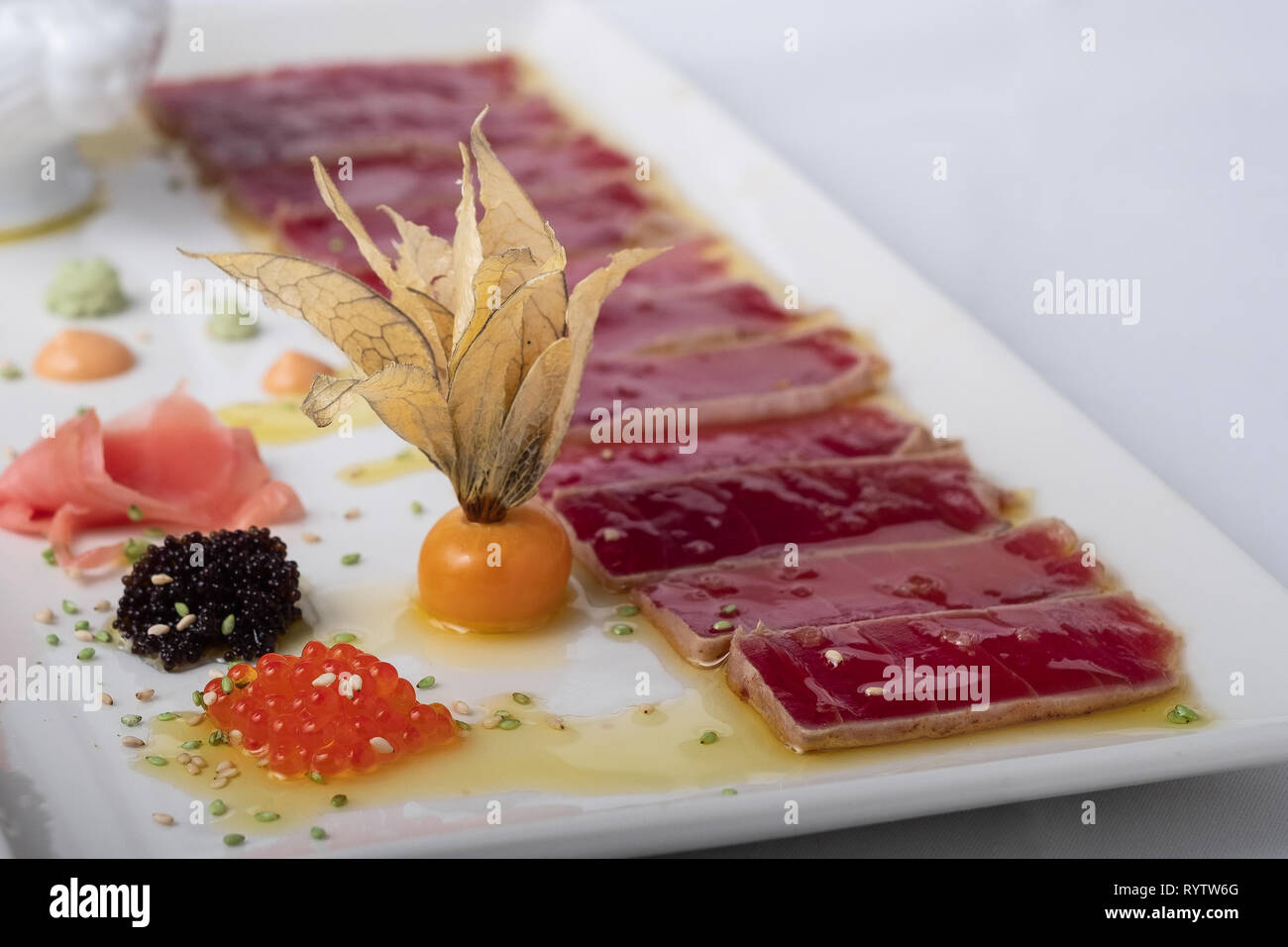 tuna tataki on olive oil background by caviar Stock Photo