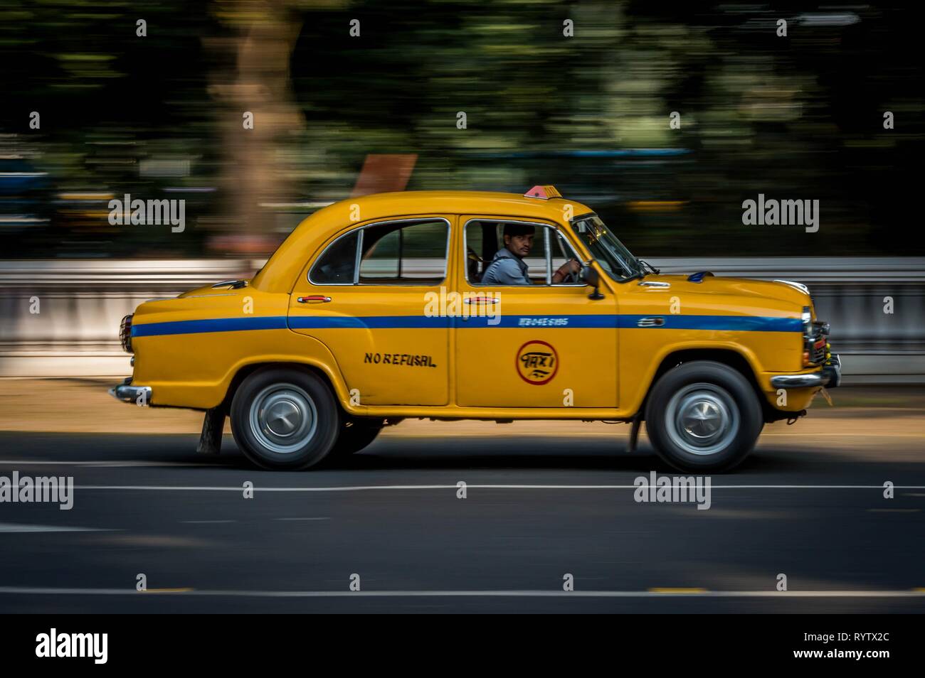 Kolkata, India - November 18th 2018: Iconic yellow taxi at Calcutta ( Kolkata ) India. The Ambassador taxi is no more built by Hindustan Motors but th Stock Photo
