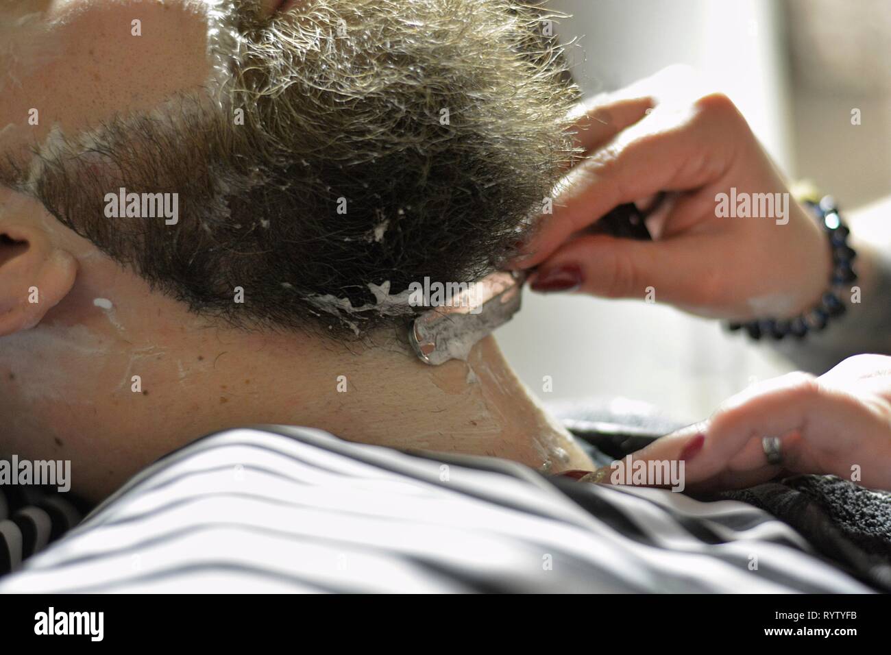 man from beard at the woman barbershop Stock Photo