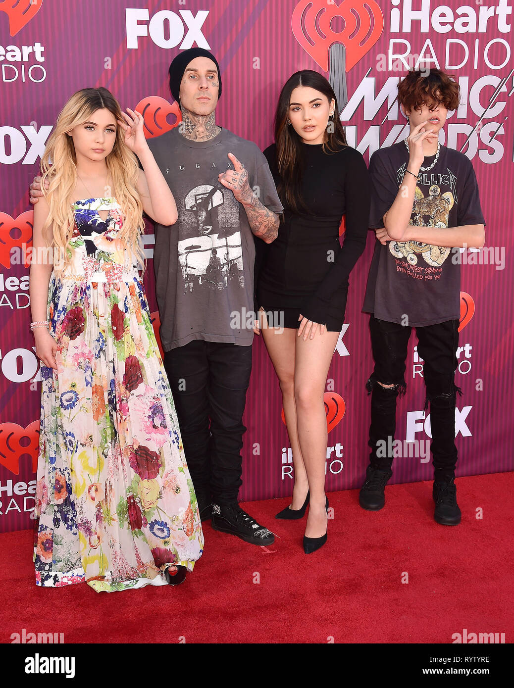 LOS ANGELES, CA - MARCH 14: (L-R) Alabama Barker, Travis Barker, Atiana