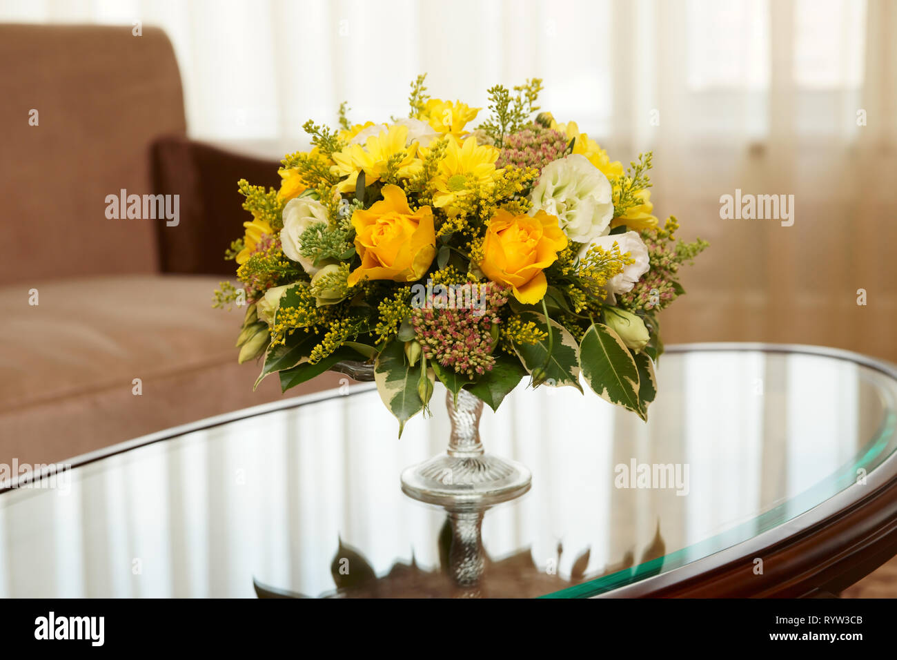 Flowers in a hotel room on coffee table Stock Photo
