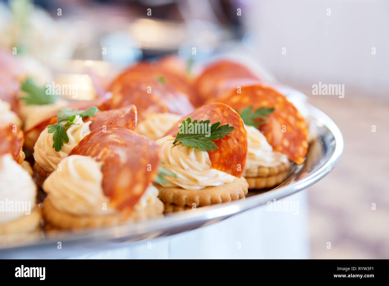 Canapes with choriso wurst on banquet table Stock Photo