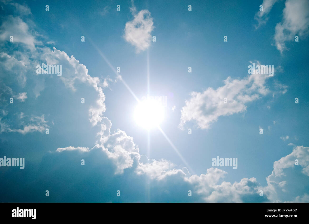 Beautiful scenic view of cloudy, sunny, blue sky in sunny day. Stock Photo
