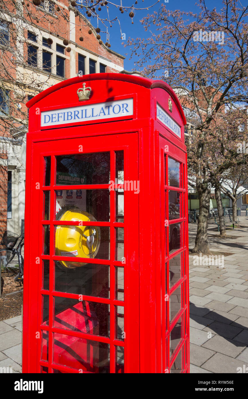 A converted Sir Giles Gilbert Scott K6 phone box now used to store a defibrillator in London, UK Stock Photo