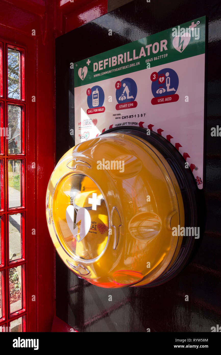 A converted Sir Giles Gilbert Scott K6 phone box now used to store a defibrillator in London, UK Stock Photo