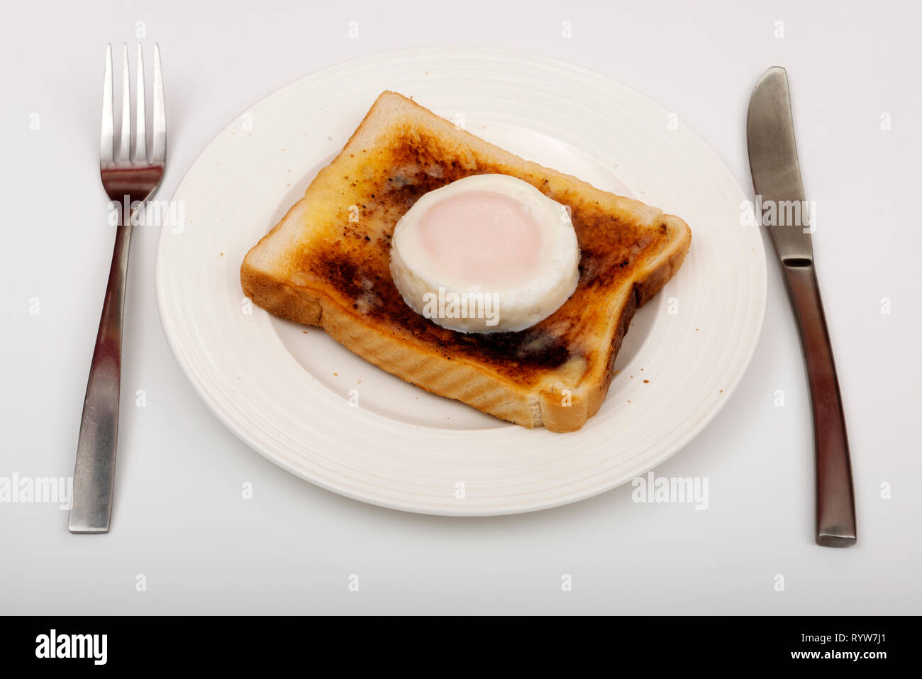 Poached egg on toast Stock Photo