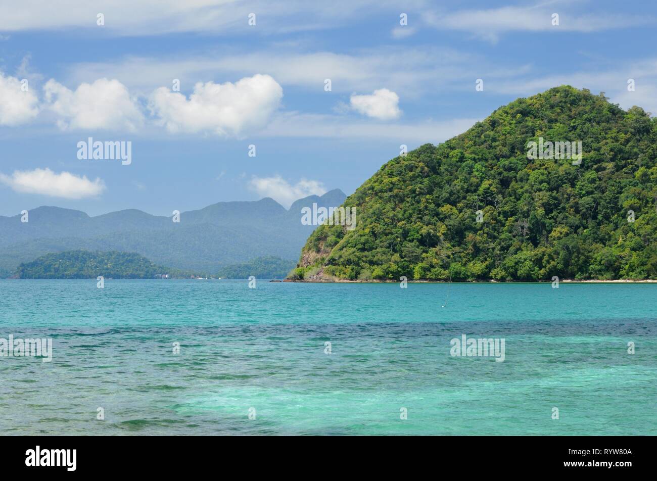 Turquoise tropical sea with mountains on horizon on Koh Chang island, Thailand. Stock Photo