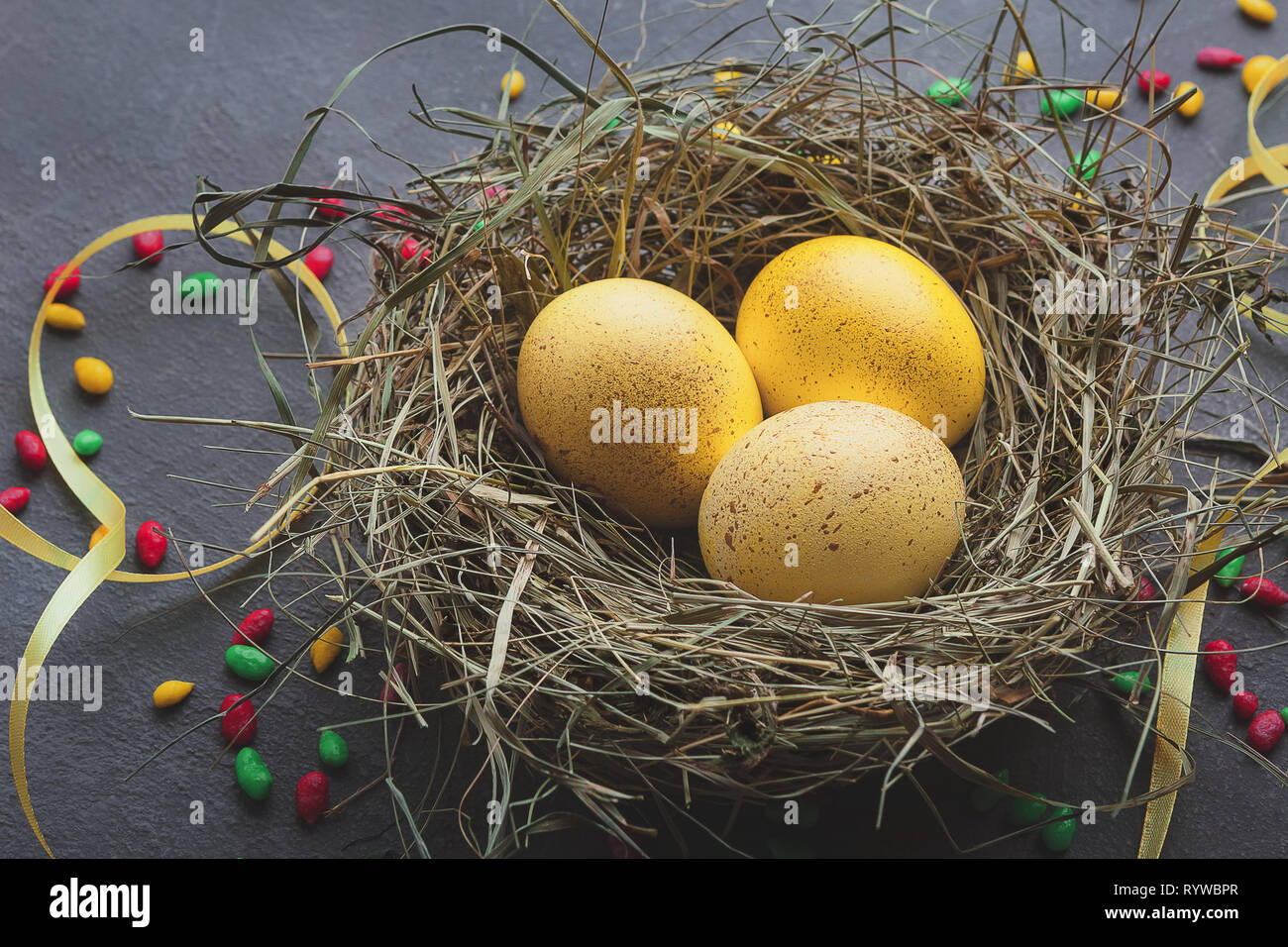 Beautiful Easter background with eggs in nest Stock Photo - Alamy