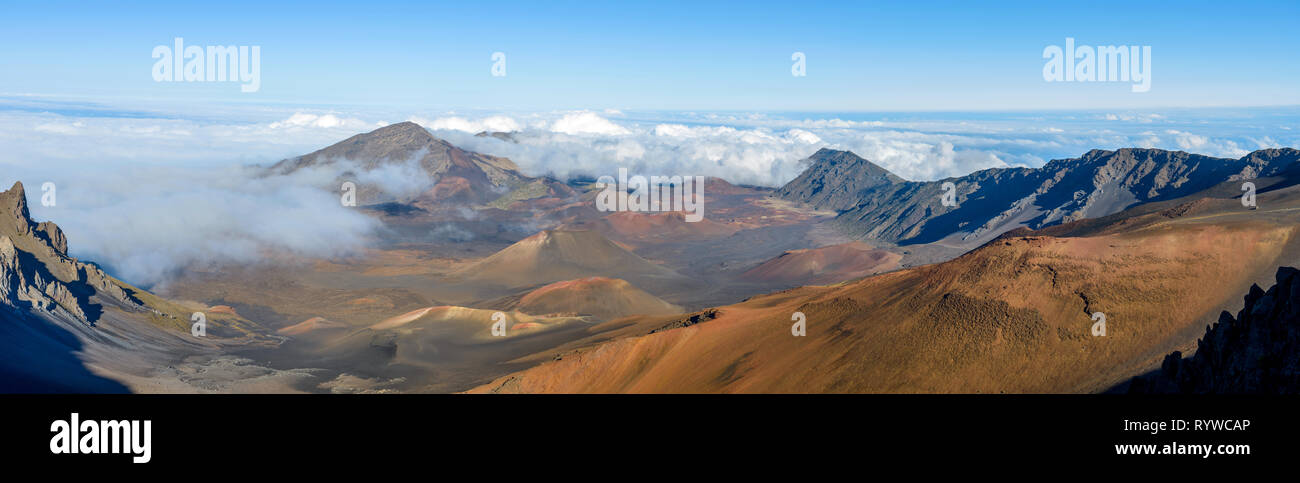 Haleakala Crater - A panoramic view of the crater at summit (10,023 feet) of Haleakala, also called East Maui Volcano, surrounded by sea of clouds. Ma Stock Photo