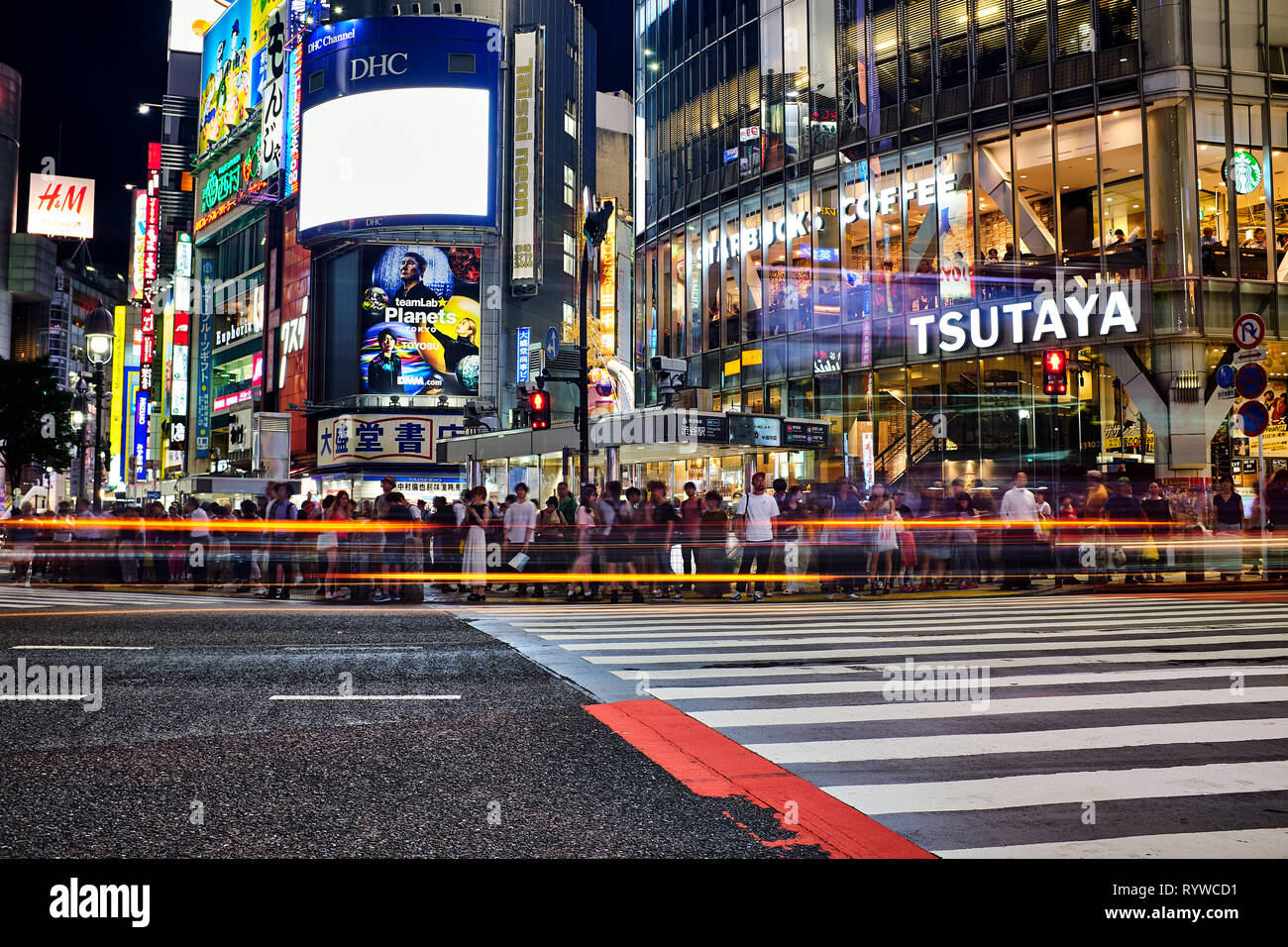 Pictured is Shibuya Crossing Tokyo at night, Japan. Stock Photo
