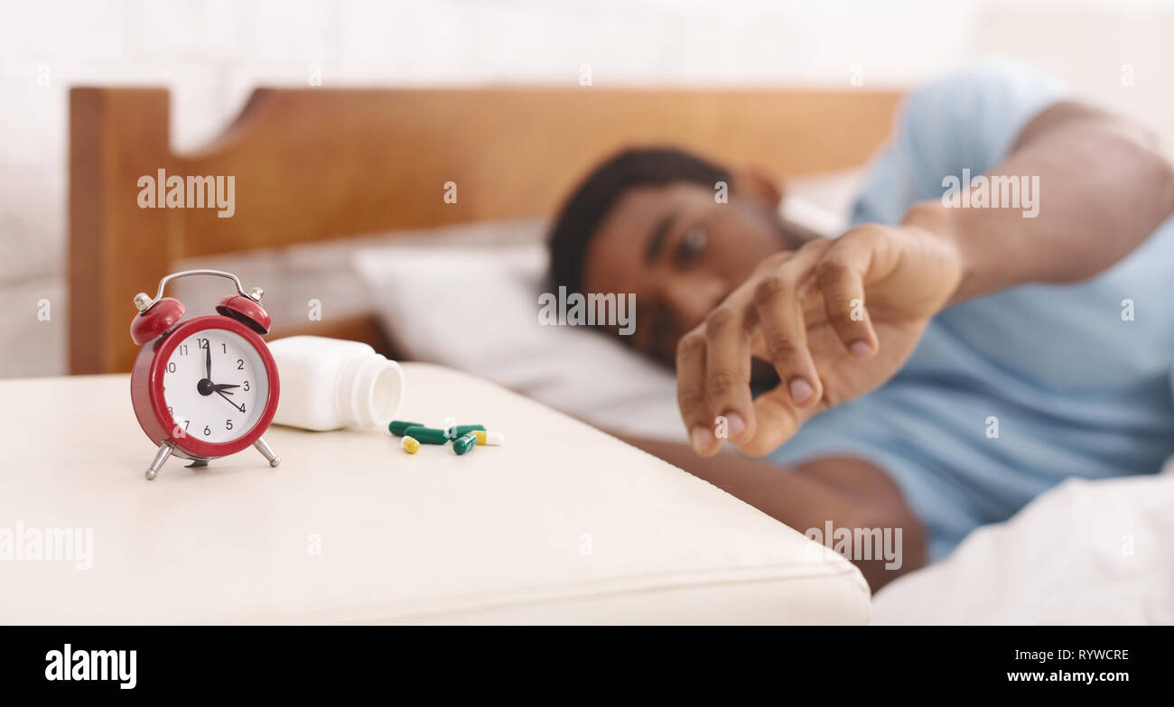 African-american man suffering from insomnia in bed Stock Photo