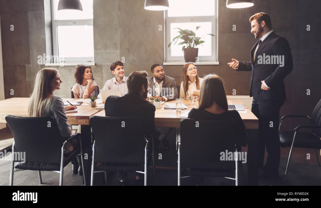 Business managers discussing project plans in office Stock Photo
