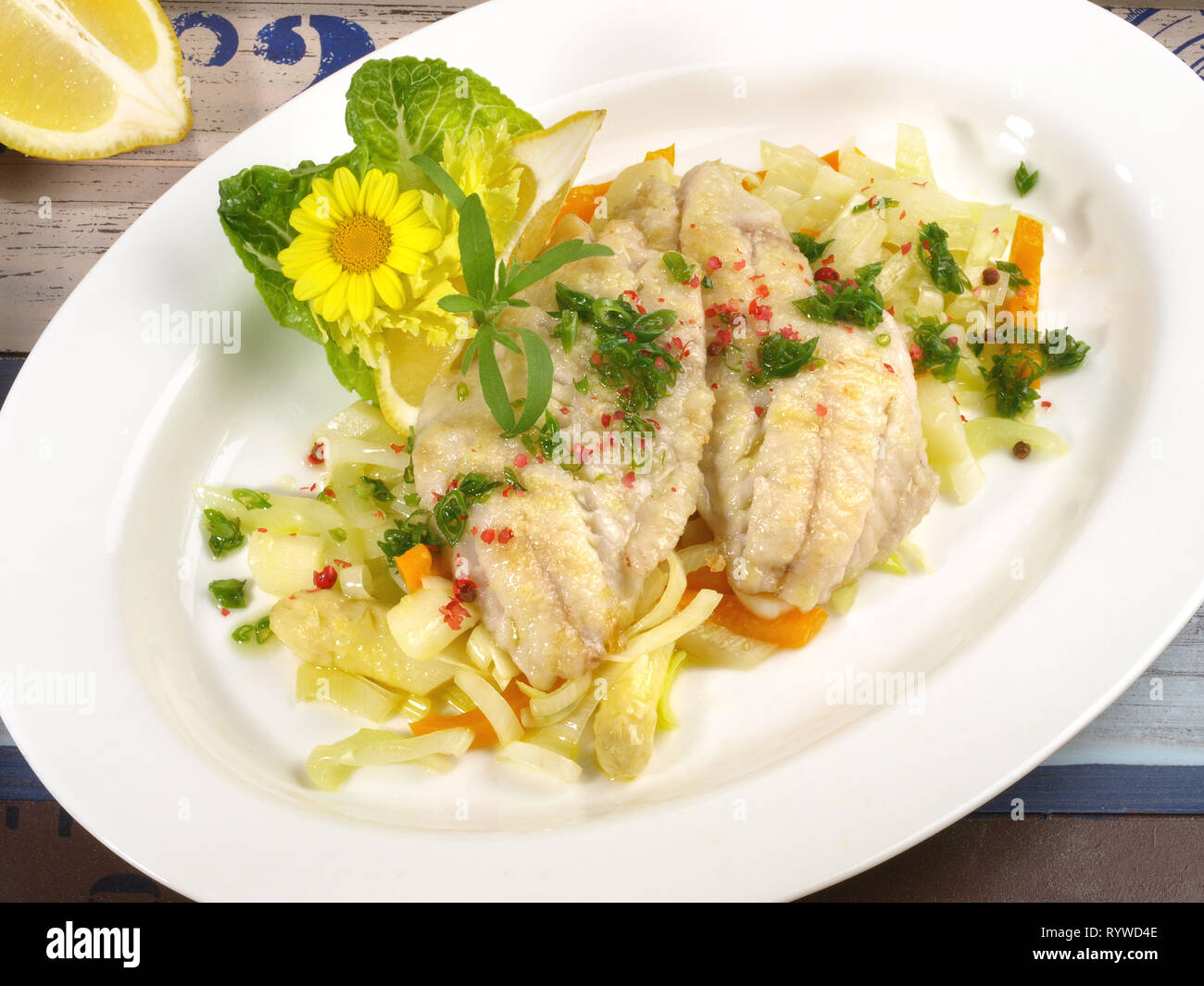 Cooked Gilthead Fillets on white Asparagus Stock Photo