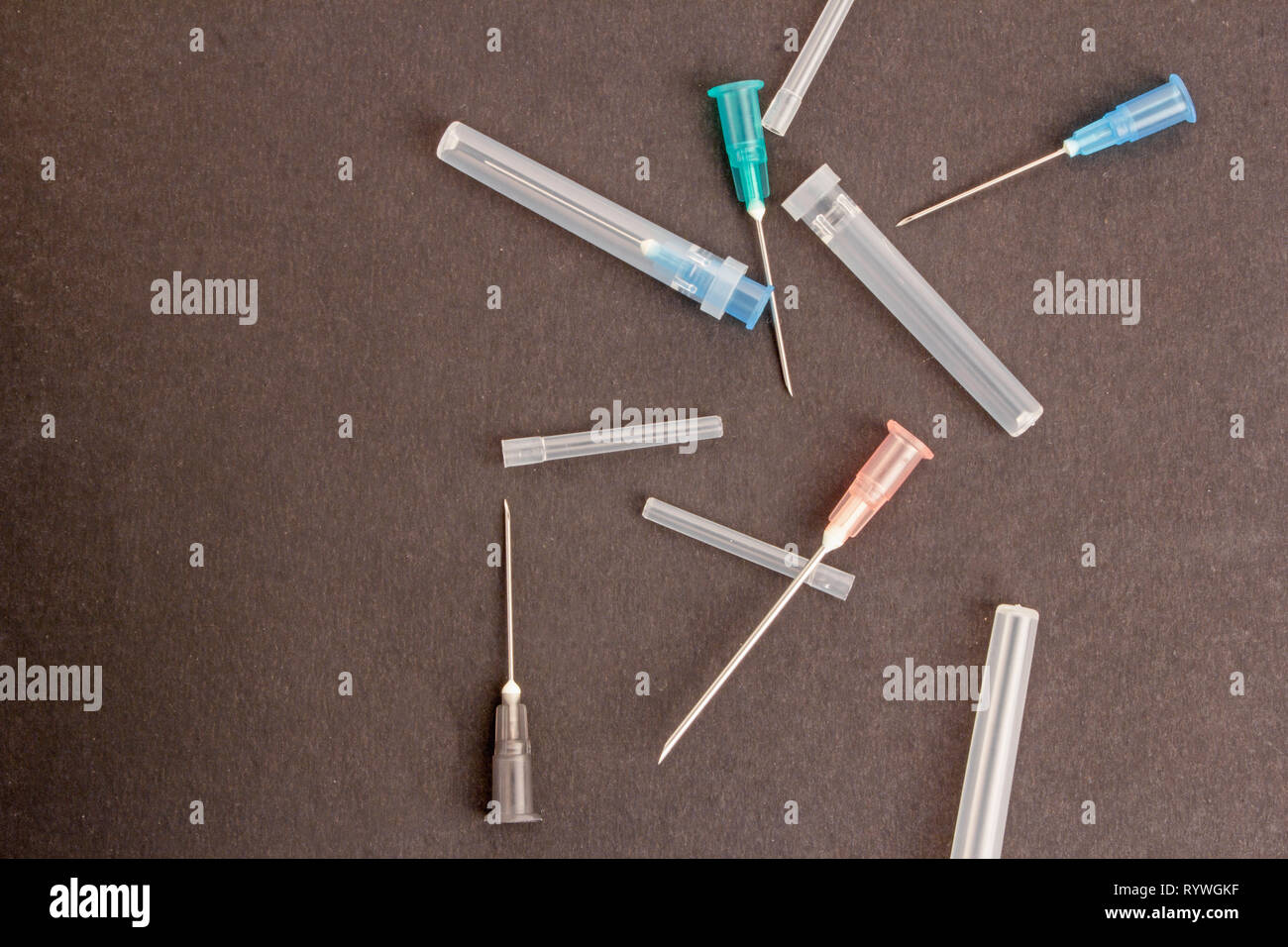 Medical syringes isolated on plain black background Stock Photo