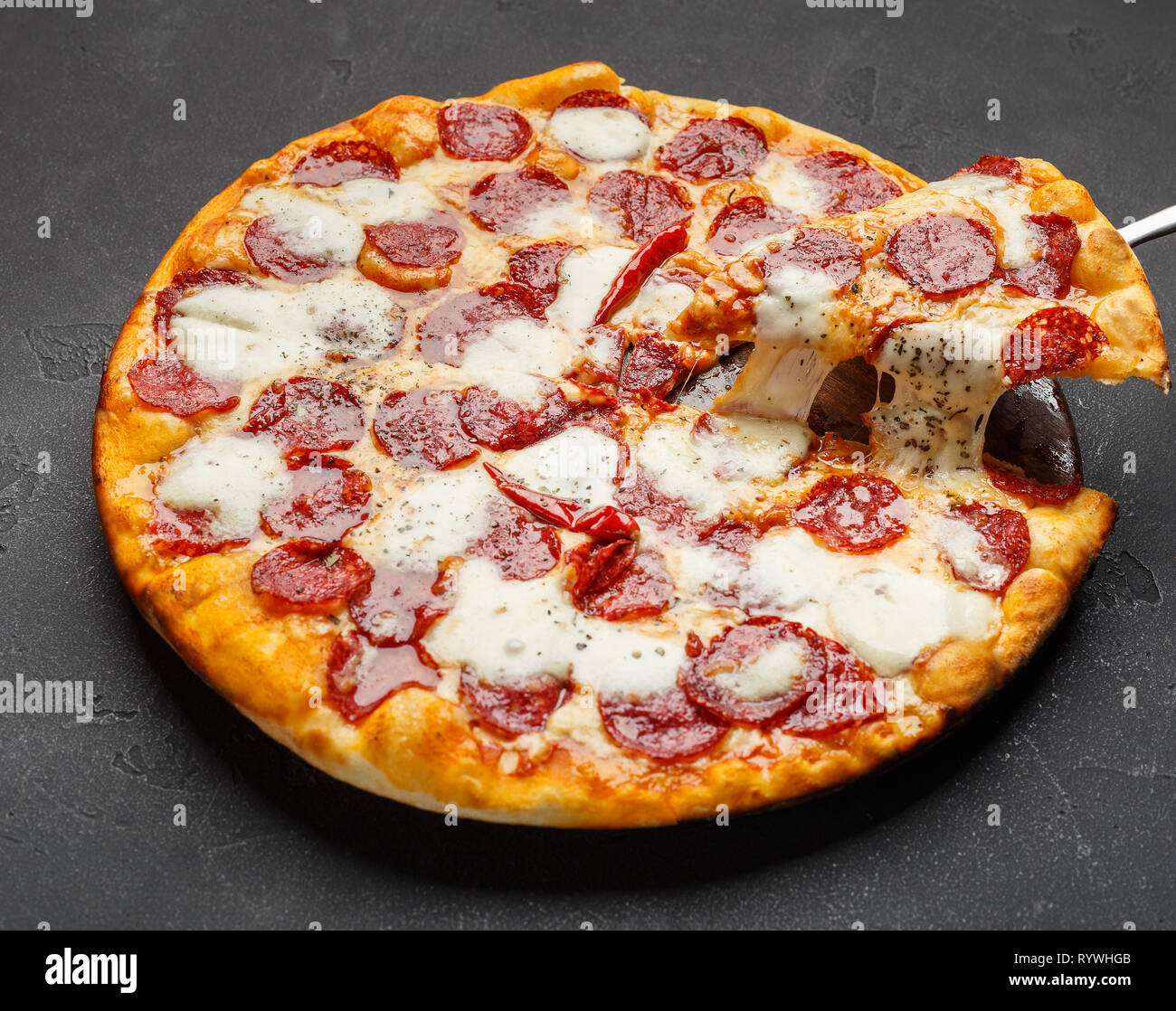 Hot pizza with melting cheese on table Stock Photo Alamy