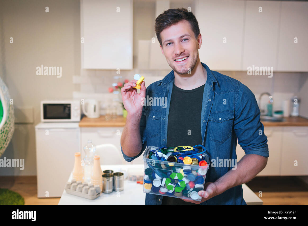 Protect the environment. Plastic lids prepared for recycling. Young