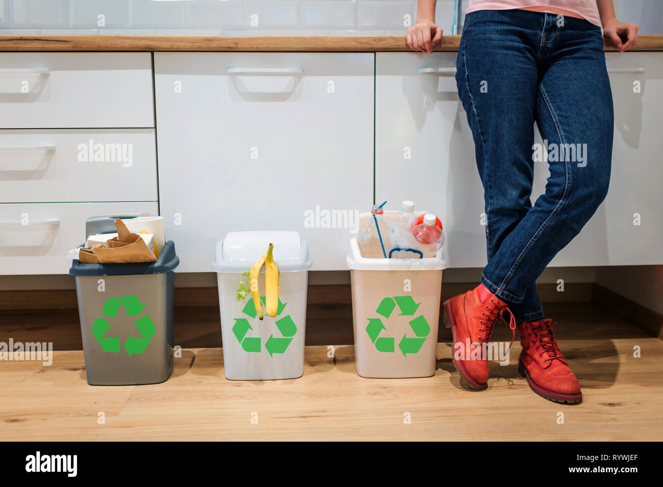 Waste sorting. Cropped view of colorful garbage bins filled with plastic, bio food, paper near