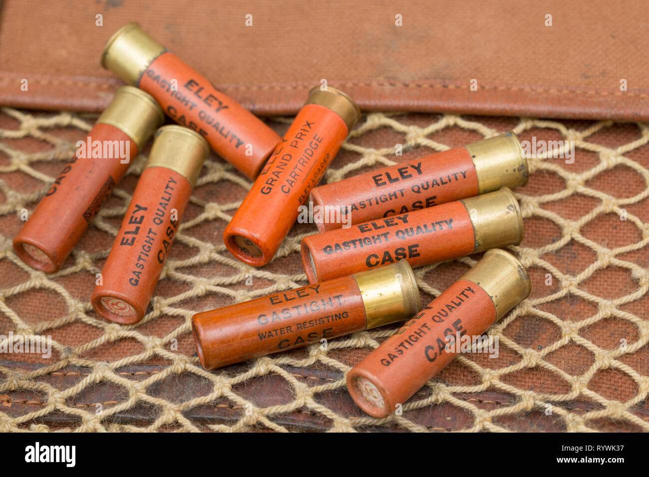 Old Eley paper cased 28-bore shotgun cartridges with rolled turnover closures loaded with leadshot. Collecting shotgun cartridges is a hobby that can  Stock Photo