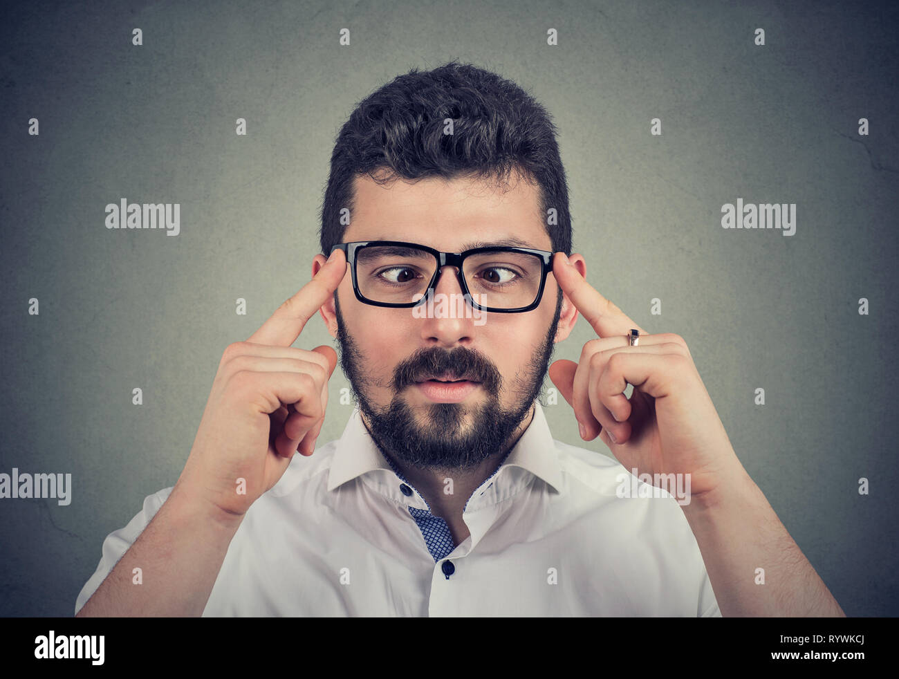 Handsome guy in glasses with strabismus Stock Photo