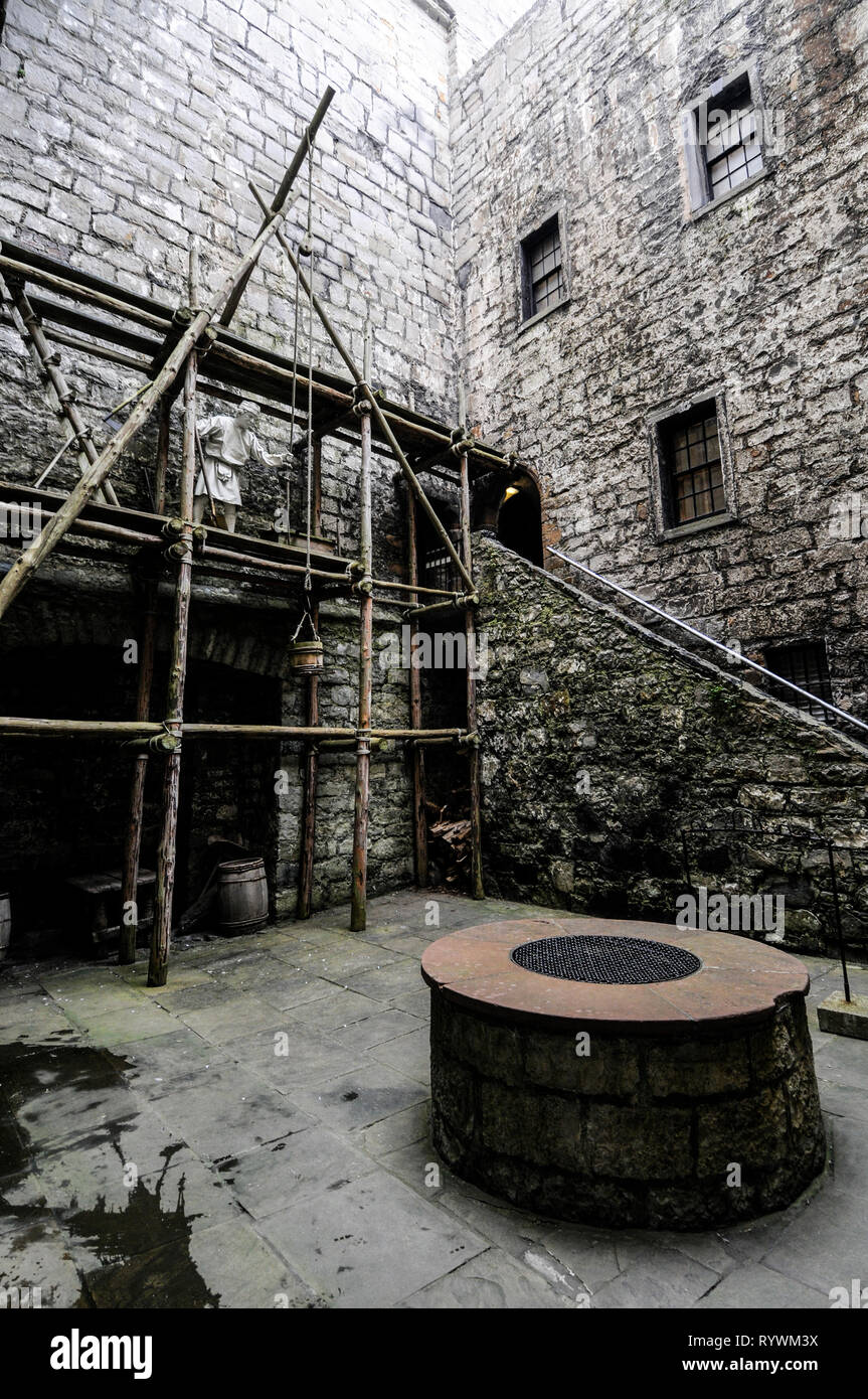 A model of a medieval builder standing on scaffolding. It is part of the castle museum on display inside Castle Rushen in Castletown on the south coas Stock Photo