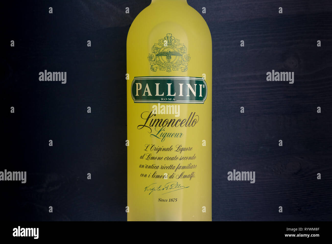 https://c8.alamy.com/comp/RYWM8F/london-march-13-2019-pallini-limoncello-lemon-liqueur-in-yellow-glass-bottle-on-dark-background-RYWM8F.jpg