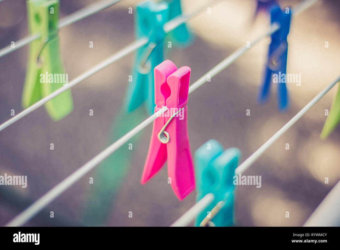 Clothespin clamp on rope, colourful, outdoors Stock Photo Alamy