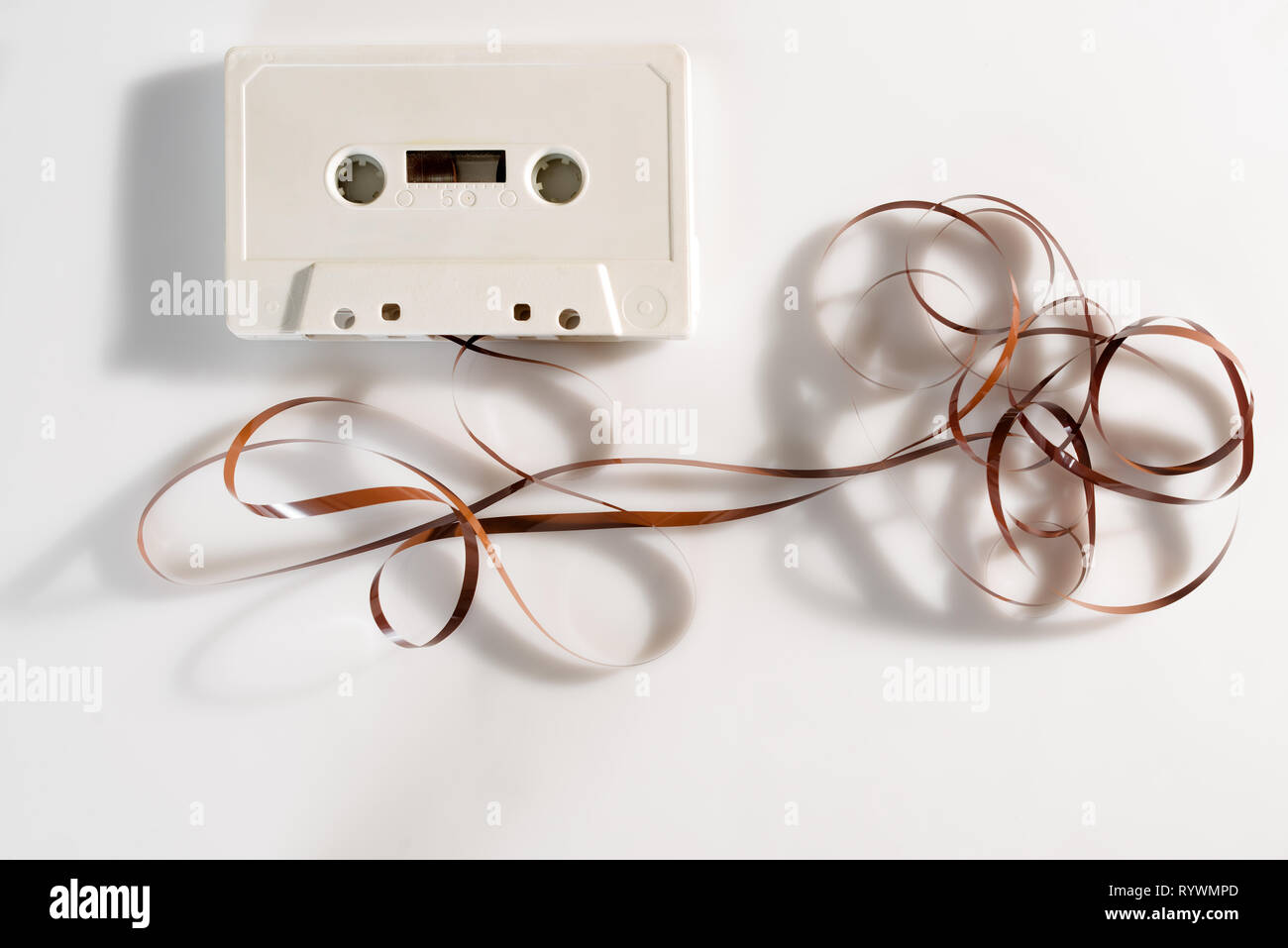 Unraveled cassette tape on white background Stock Photo Alamy