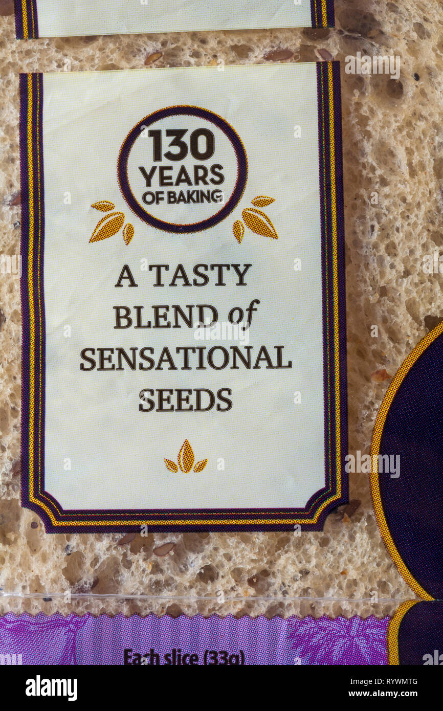 A tasty blend of sensational seeds, 130 years of baking - detail on loaf of  Hovis Seed Sensations bread Stock Photo