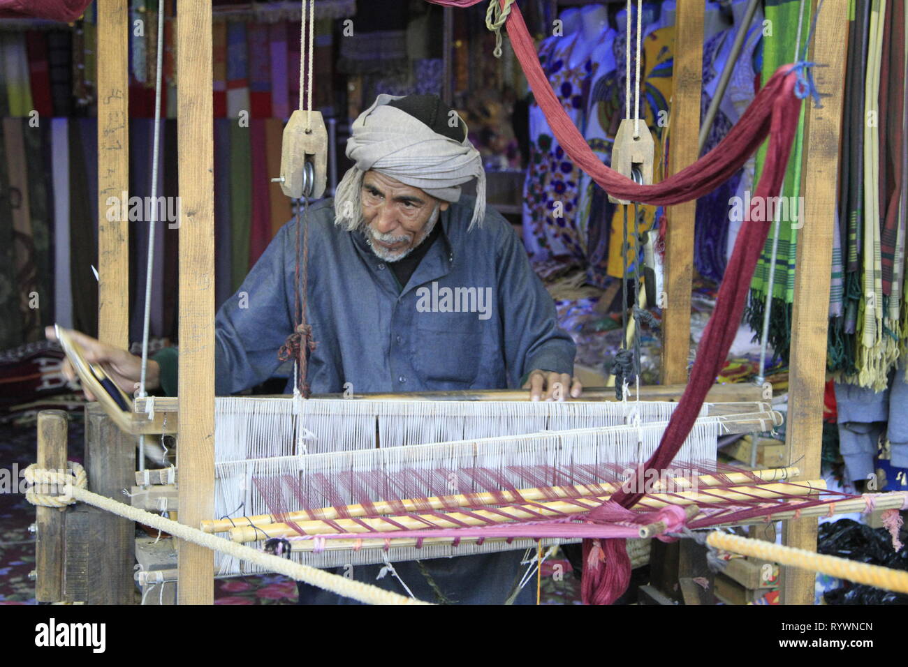 Man weaving textiles and scarves on a loom, Elephantine Island, Aswan