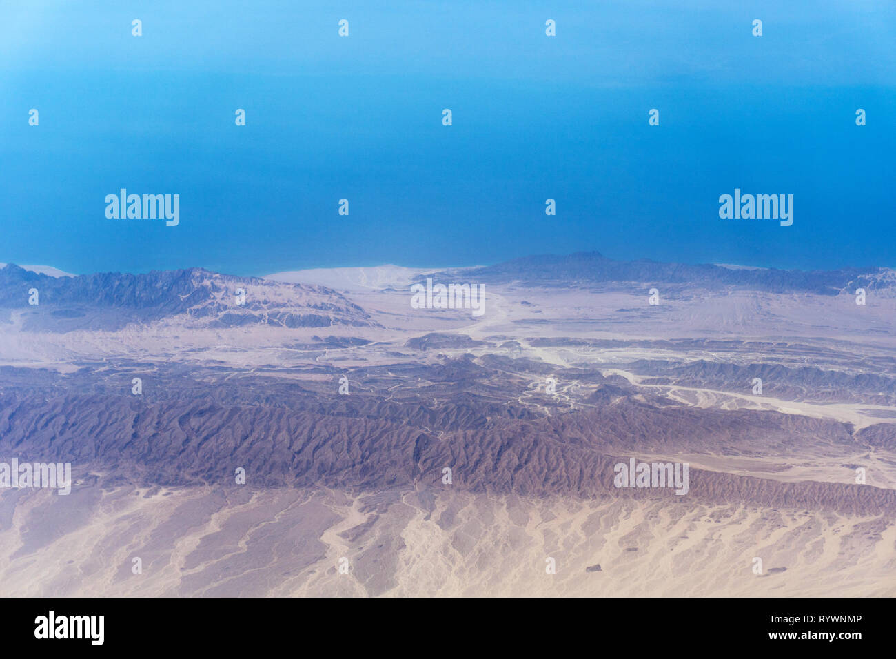 Blue sky over hilly terrain, aerial view Stock Photo