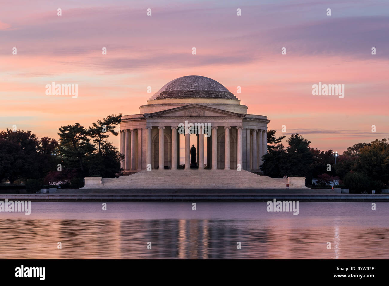 Jefferson Memorial in a beautiful sunrise with pink clouds at Washington DC National Mall Stock Photo