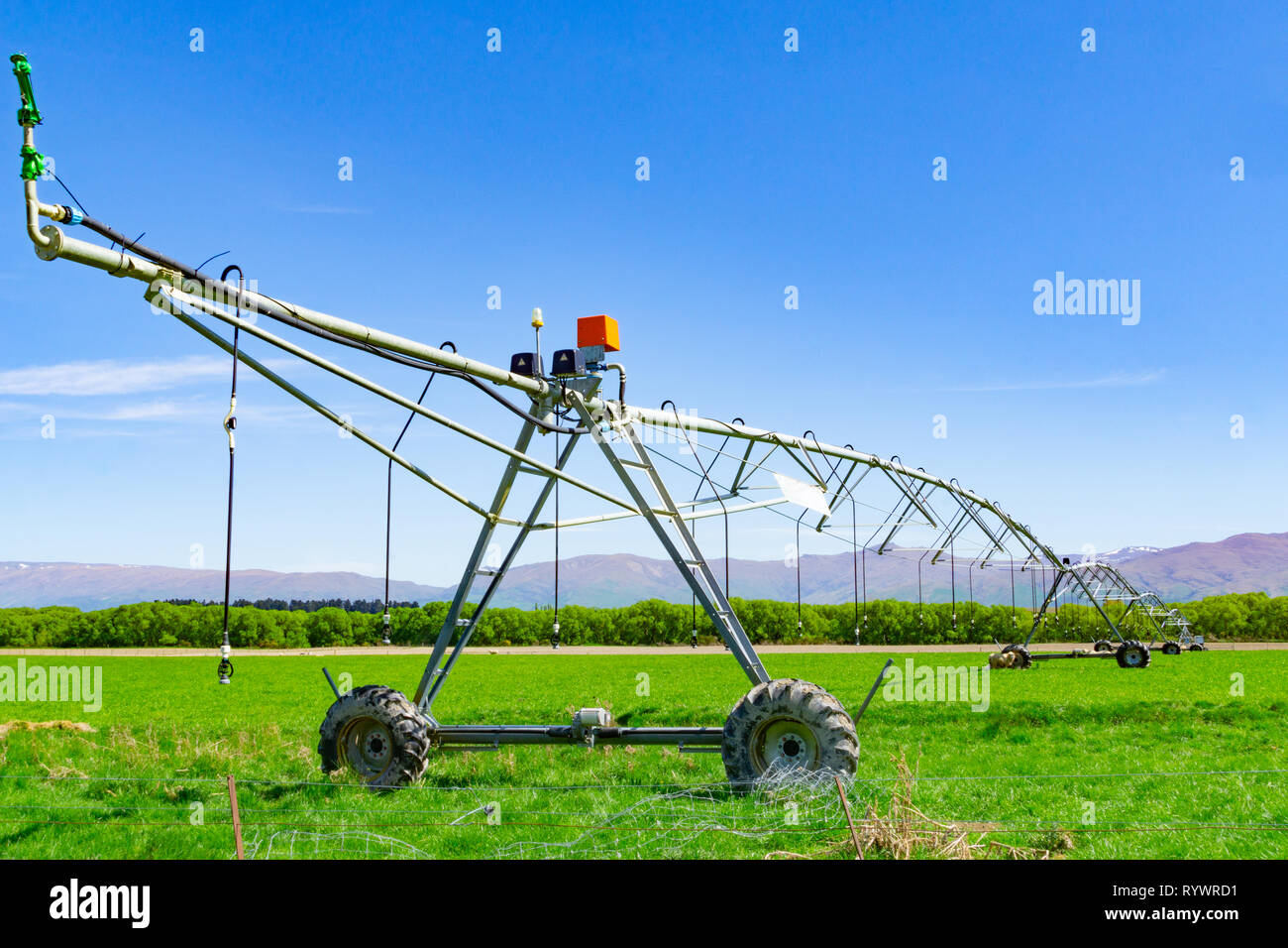 Large farm irrigation sprinkler watering hires stock photography and