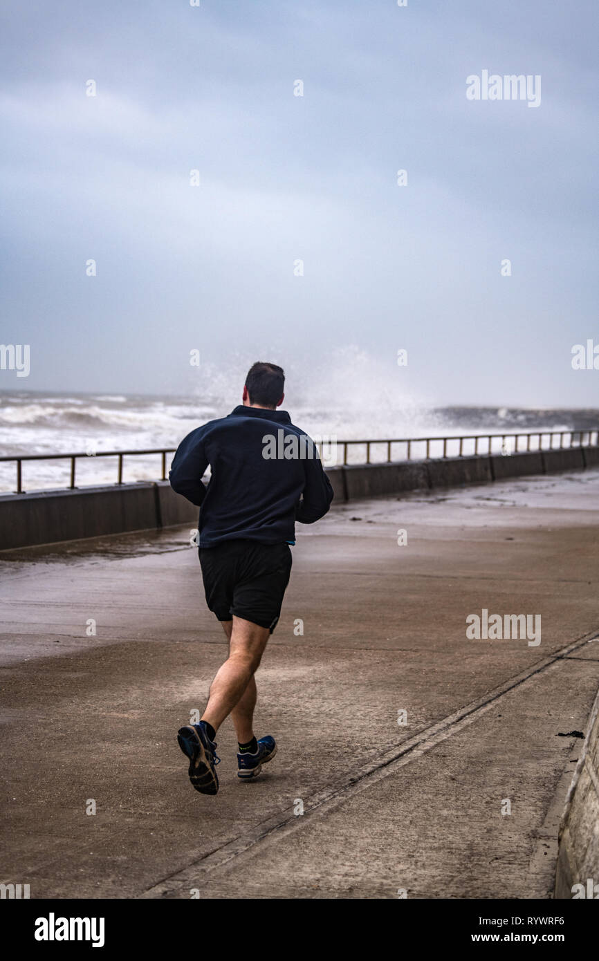 jogger in bad weather Stock Photo