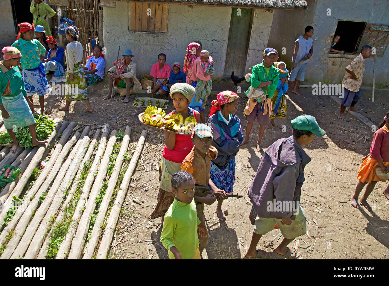 Curious local people of the railway station as well as small traders. The train Finarantsoa to Manakara, Madagascar. Stock Photo