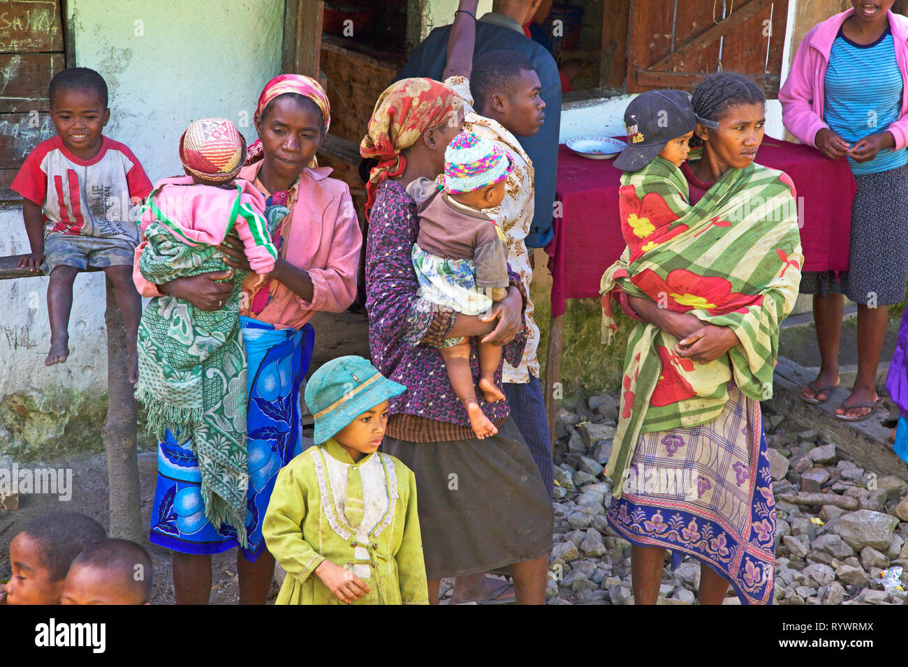 Local people wait to see the train at one of the stations along the Fianarantsoa to Manakara. Madagascar. Stock Photo