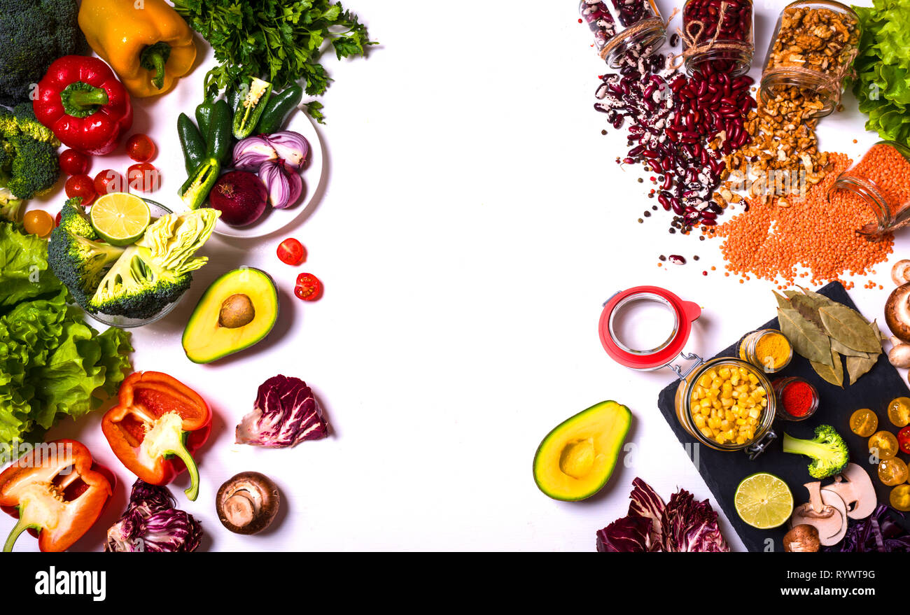 Vegetables and Fruits Arrangement on white background. Different colorful fresh vegan food. Flat lay. Place for inscription. Stock Photo