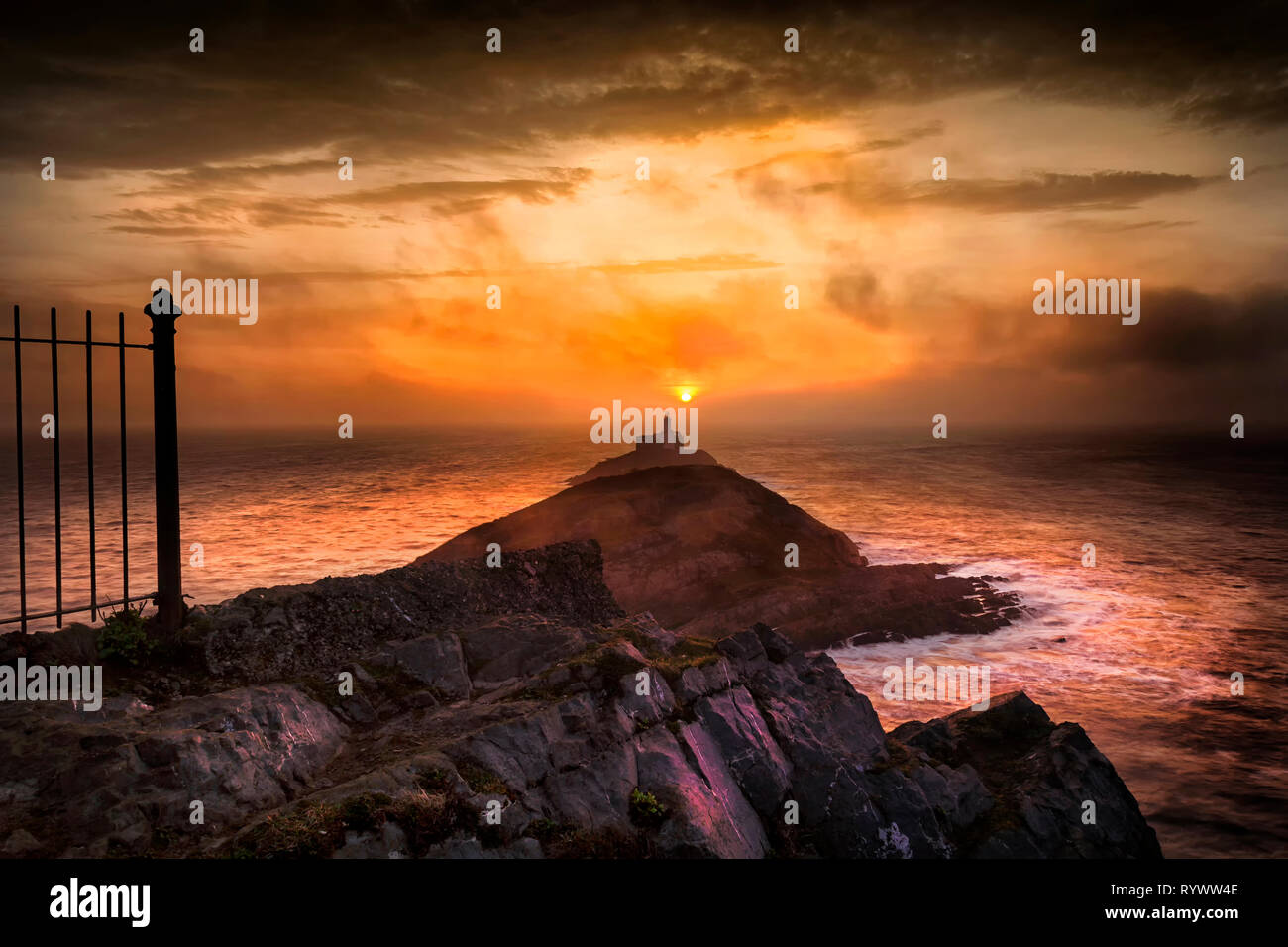 Sunrise at Mumbles lighthouse Stock Photo