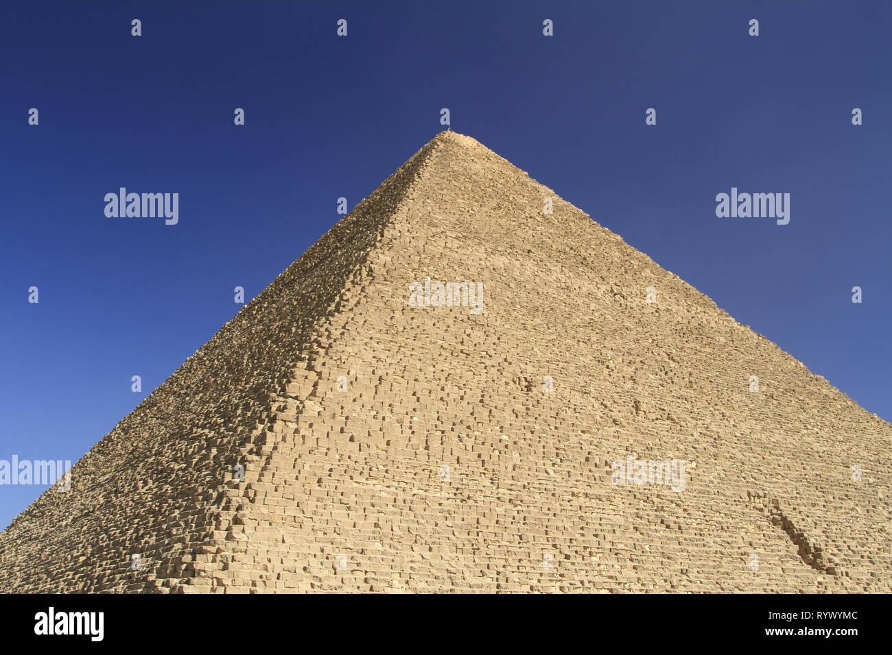 The profile of the Pyramid of Khufu, blue sky, and a sense of the size of the building blocks, Giza Pyramid Complex, Cairo, Egypt Stock Photo