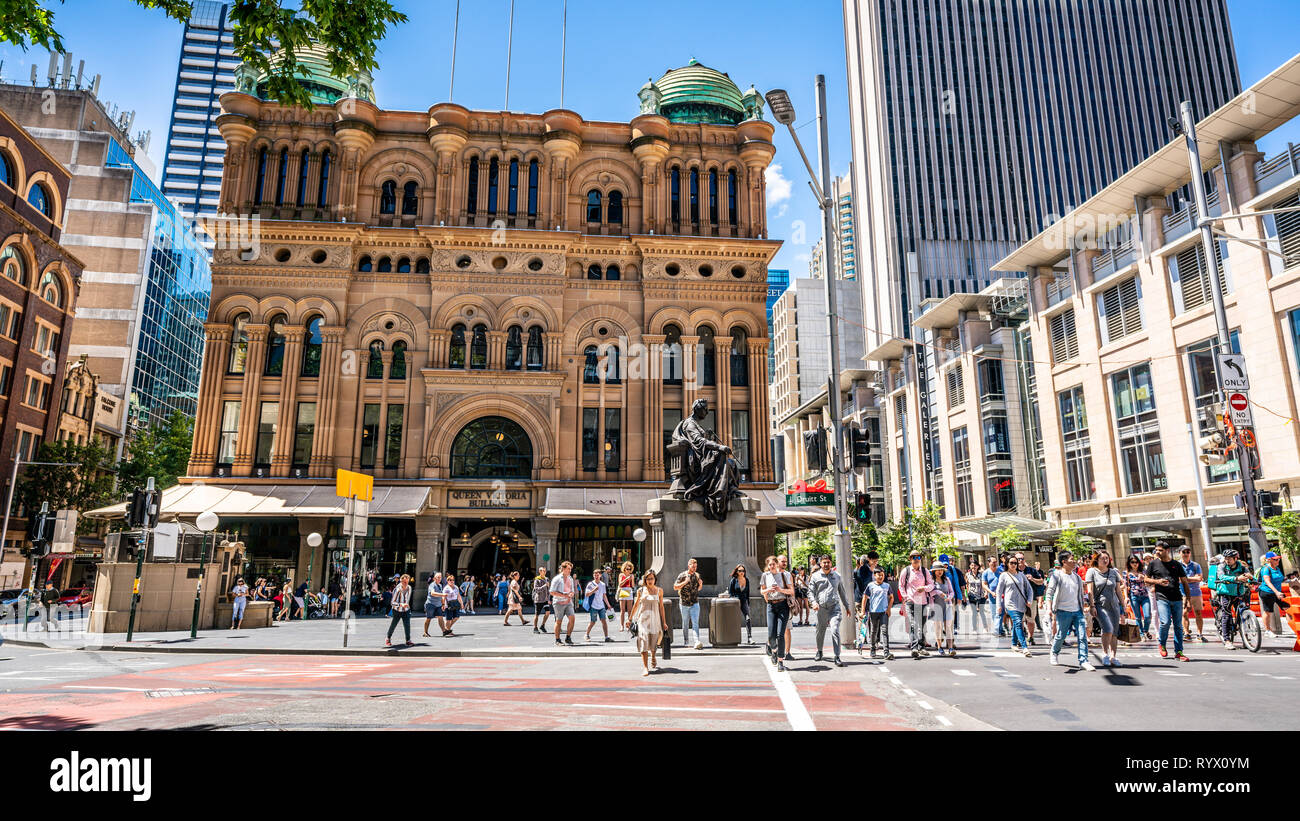 23rd December 2018, Sydney NSW Australia : Facade view of the Queen Victoria Building or QVB with lot of people crossing the road in Sydney NSW Austra Stock Photo