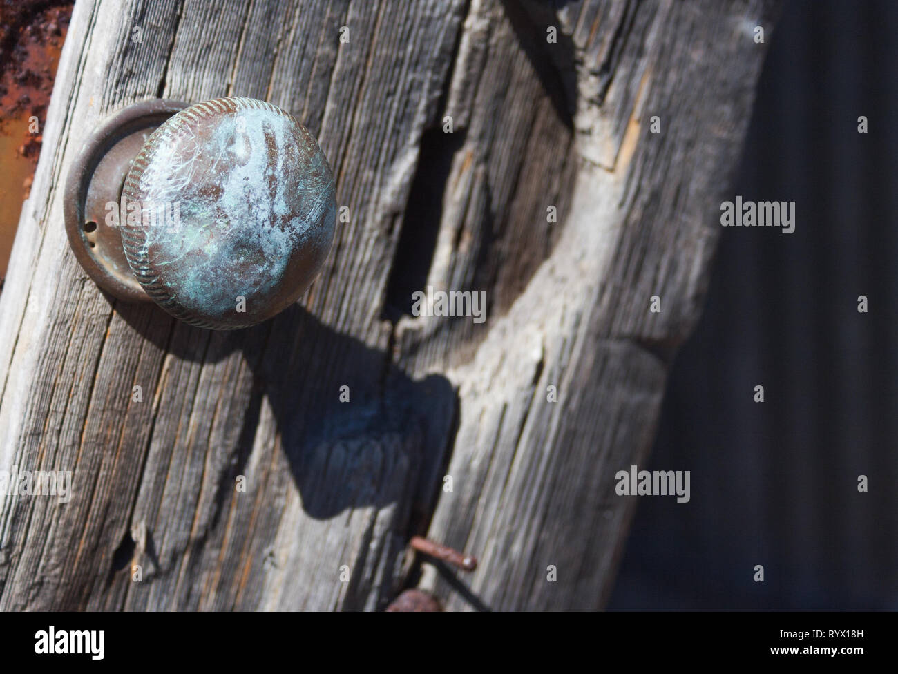 door knob on broken shed door Stock Photo