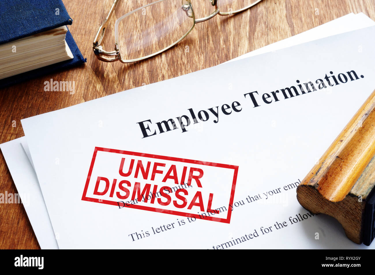 Unfair dismissal stamp on the Employee Termination. Stock Photo