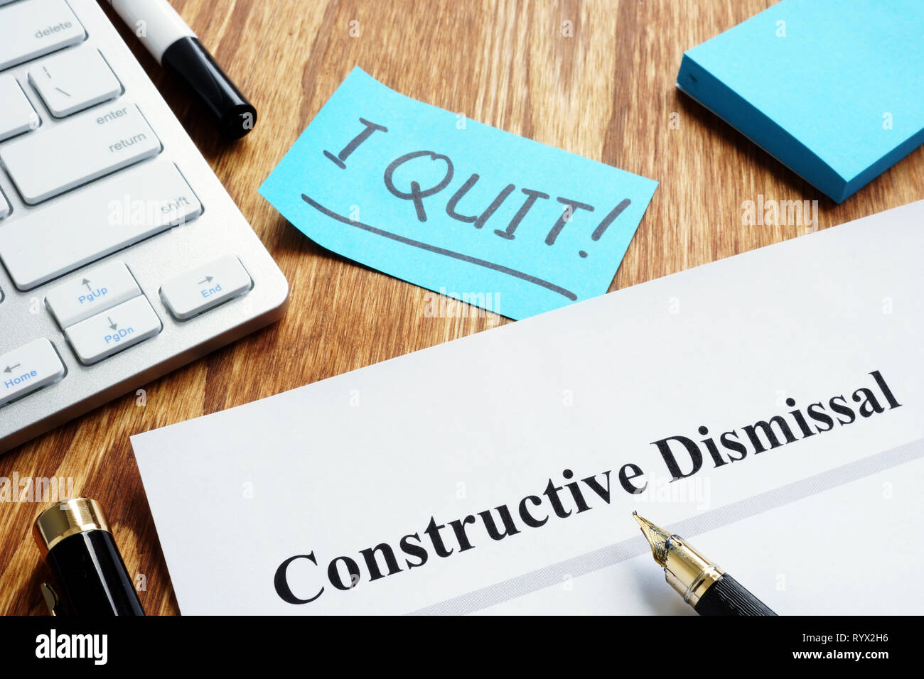 Constructive dismissal papers on the workplace. Stock Photo