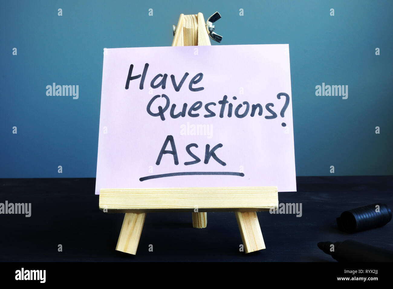 Piece of paper with sign Have questions Ask. Stock Photo