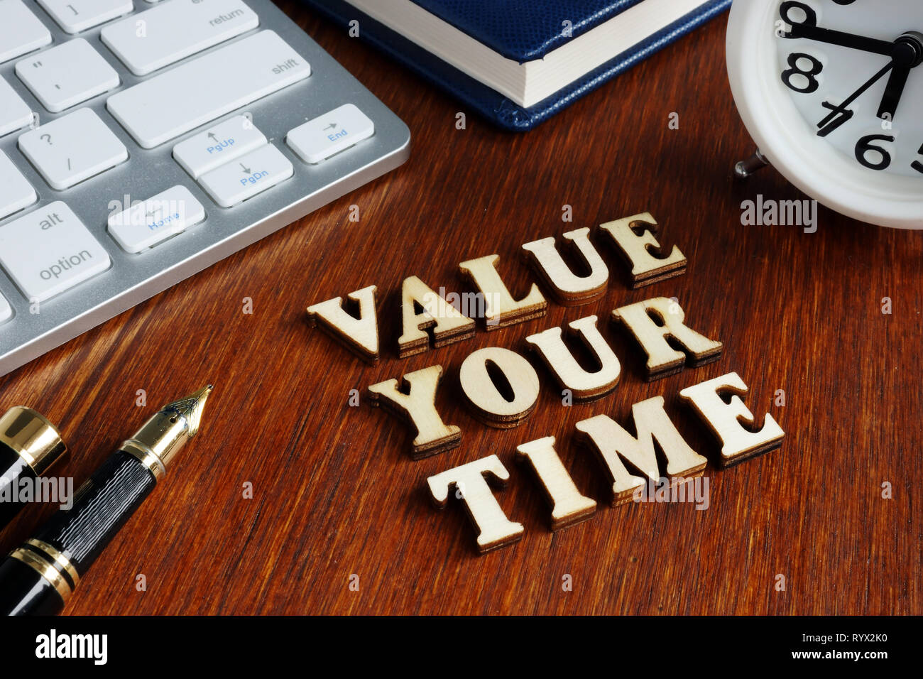 Value your time from wooden letters. Stock Photo