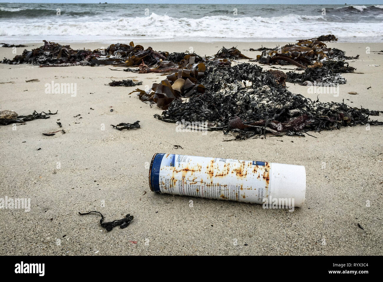 Marine pollution on a beach in Brittany (north-western France). aerosol; Stock Photo